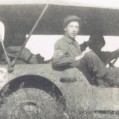 Three men in a jeep