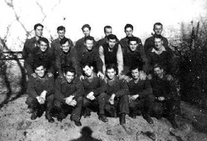 Group photo of 18 POWs on farm detail in Unterthurheim, Germany.