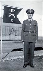 Otis Vanderpool with 157th Infantry flag.