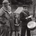 45th MP looks on as town crier speaks.