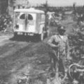 Abulance passing through the destroyed Montelmar, France.