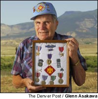 Vere "Tarzan" Williams displaying his medals.